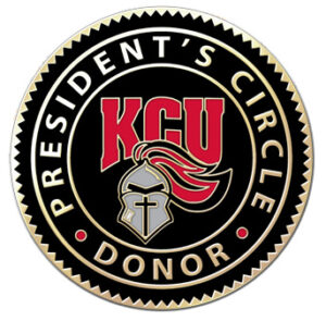 KCU President's Circle Donor emblem featuring a helmet logo with red accents on a black background.